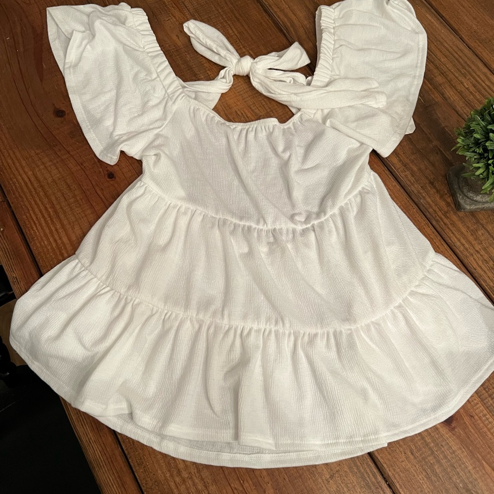 Brand new backless peplum blouse